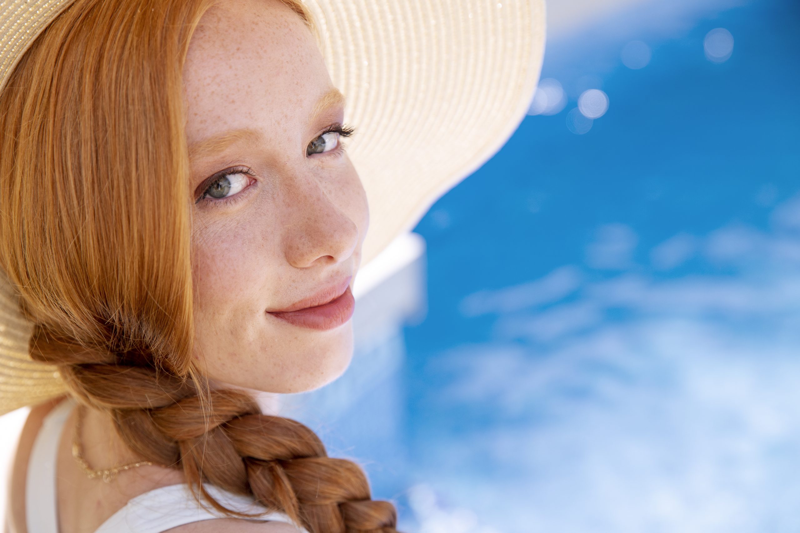 close-up-smiley-woman-by-pool
